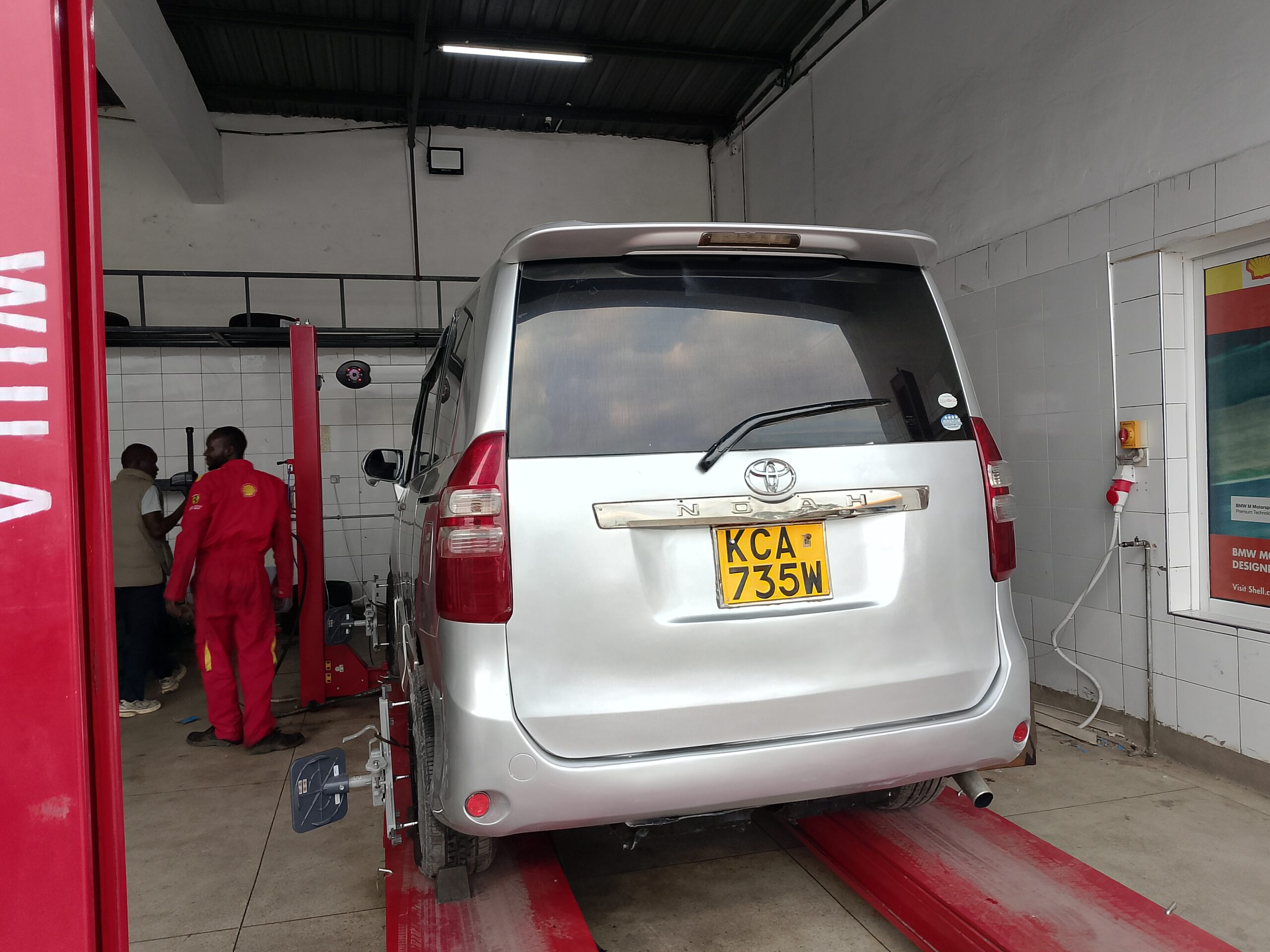 Organic Food Kenya team with the community vehicle